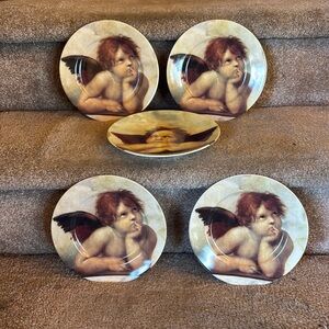 Angel dishes, 4 exactly the same one different.